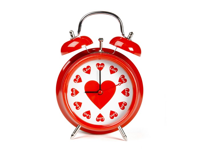 Red alarm clock with hearts and 'Love' text