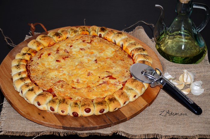 Pizza with sausage rolls crust and cheese