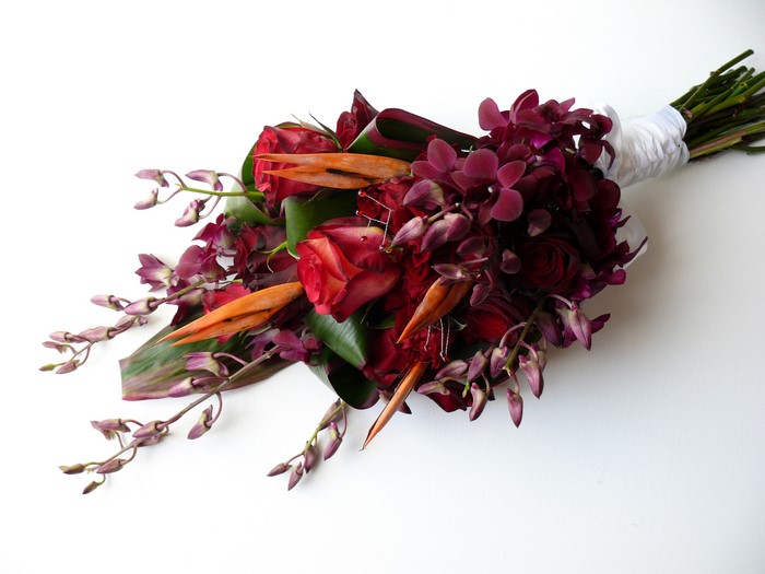 Red roses and purple orchids bouquet