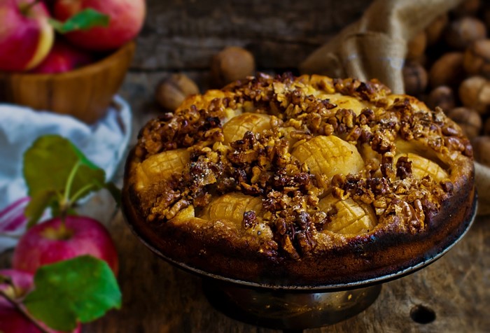 Apple and walnut cake on a cake stand