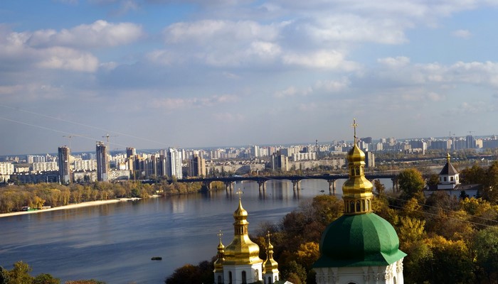 Kyiv cityscape with river and church domes