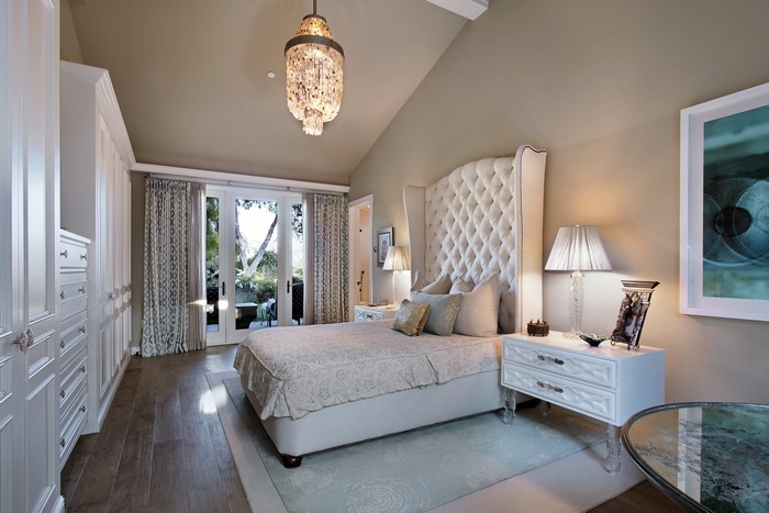 Bedroom with Chandelier and Bed