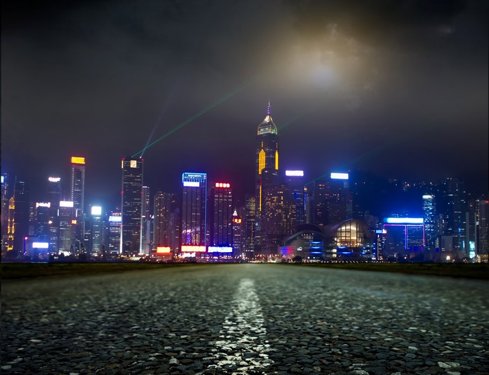 Cityscape at Night with Laser Show and Road