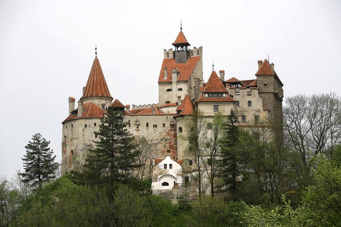 Bran Castle in Romania surrounded by trees
