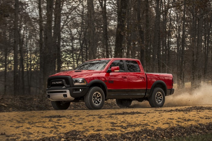 Red Ram 1500 Rebel driving on a dirt road