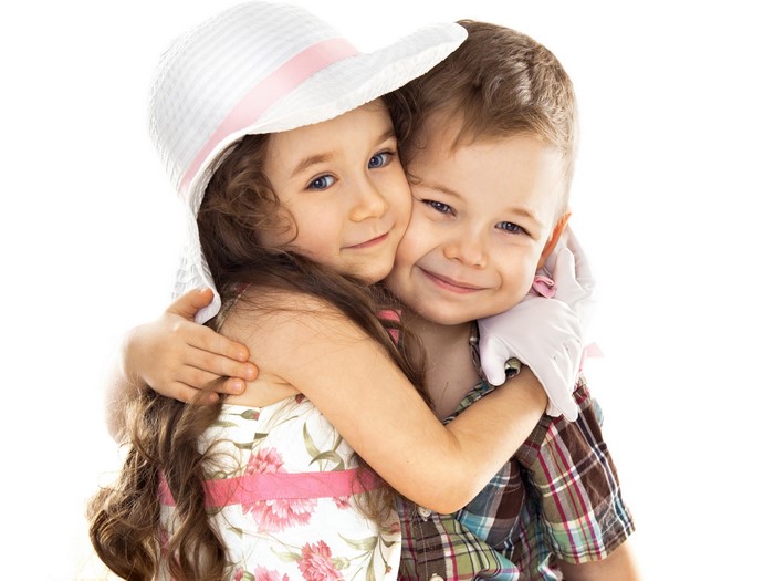 Girl in Hat Hugging Boy