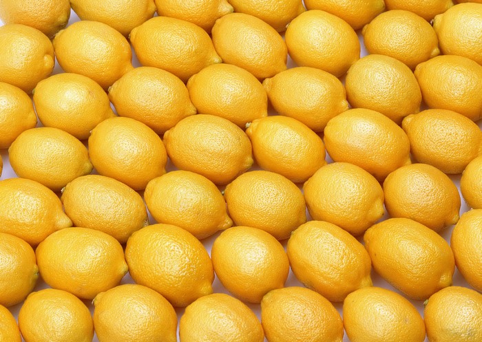 Many lemons arranged in rows