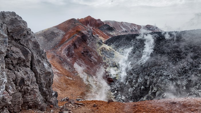 Volcanic landscape with steam on Kamchatka Peninsula, Russia