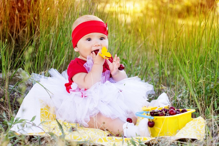 Baby girl in red and white tutu with cherries