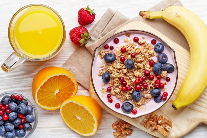 Still-life of Muesli with Berries, Banana, Orange, and Juice