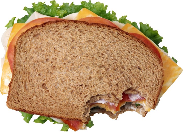 Whole wheat sandwich with turkey, cheese, tomato, and lettuce