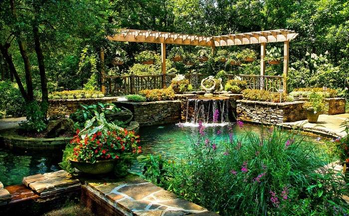 Gibbs Gardens pond with waterfall and pergola