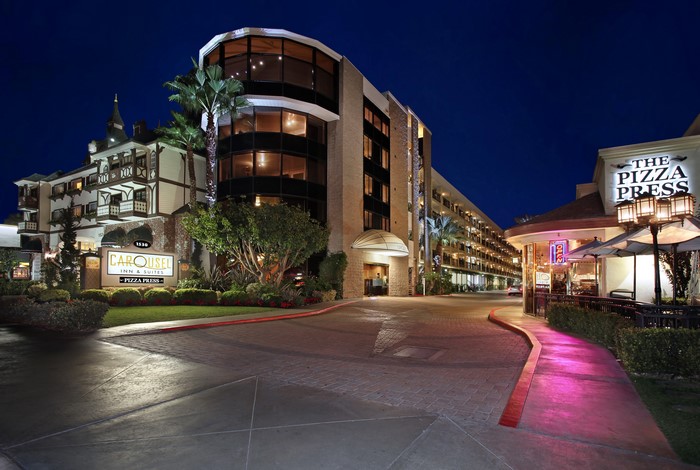 Carousel Inn & Suites and The Pizza Press in Anaheim, California at Night