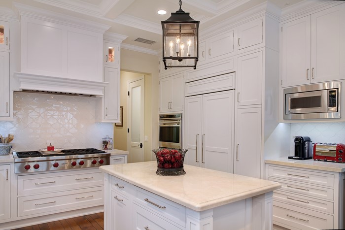 Kitchen with white cabinets and island