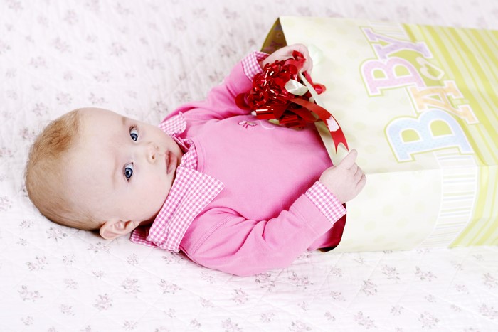Baby looking out of a gift bag