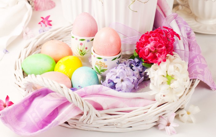 Easter eggs and hyacinths in a wicker basket