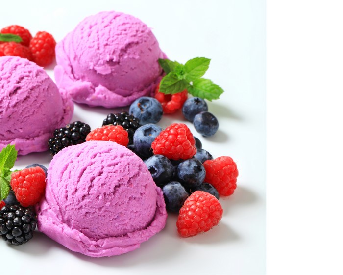Berry ice cream scoops with fresh berries and mint