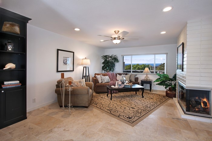 Living room with fireplace and ocean view