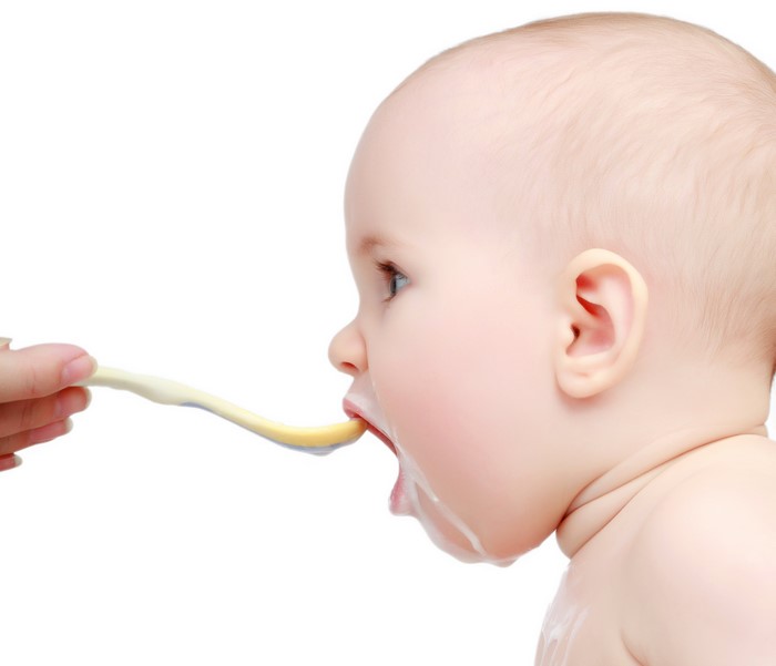Baby being fed with a spoon
