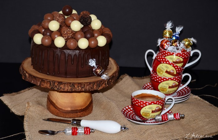 Chocolate cake with truffles and coffee cups