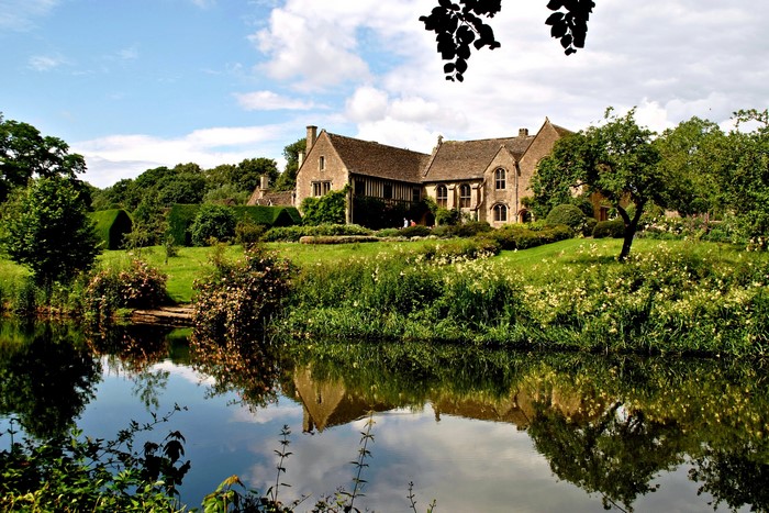 Stone house with pond in Atworth, England