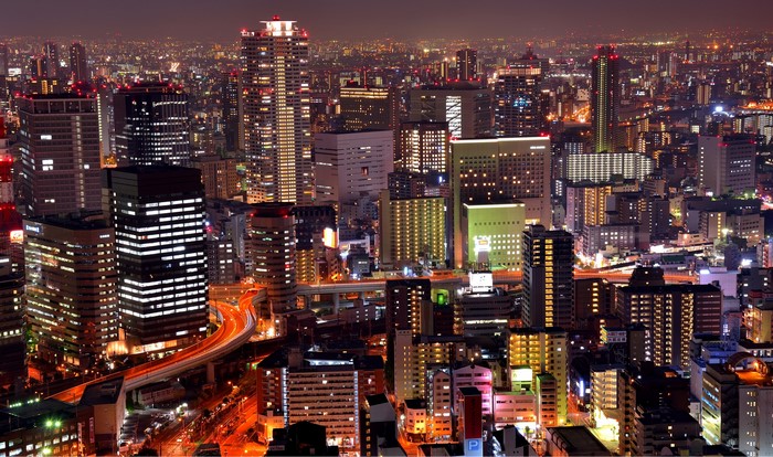 Osaka cityscape at night with illuminated skyscrapers