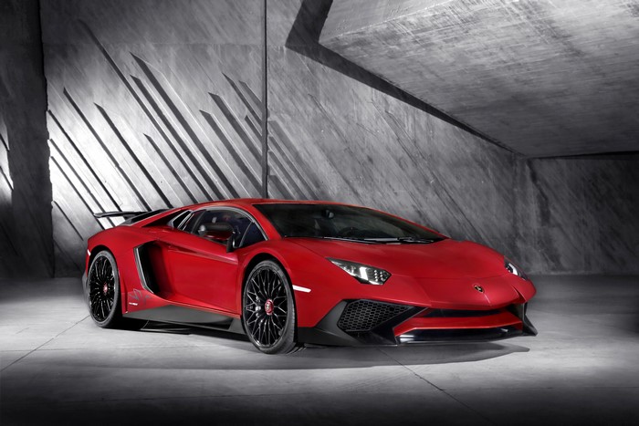Red Lamborghini Aventador LP750-4 SV in a concrete garage