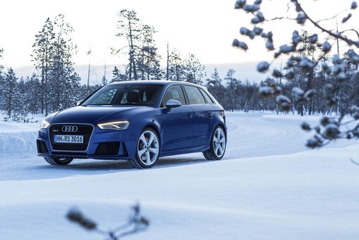 Blue Audi RS3 Sportback in a Snowy Forest