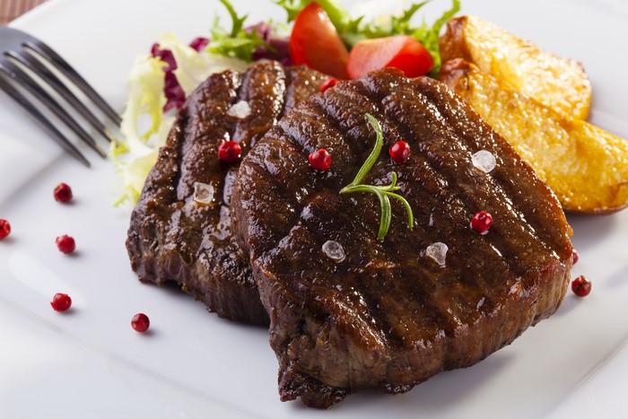Steak with roasted potatoes and salad