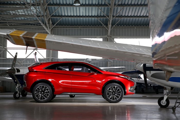 Red Mitsubishi XR-PHEV II concept car in hangar