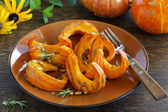 Roasted Pumpkin Slices on a Plate with Rosemary