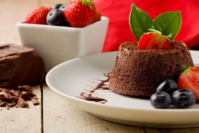 Chocolate dessert with strawberries and blueberries