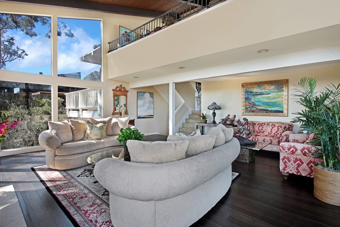 Living room with sofas and large windows