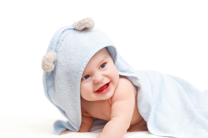 Baby in a blue hooded towel