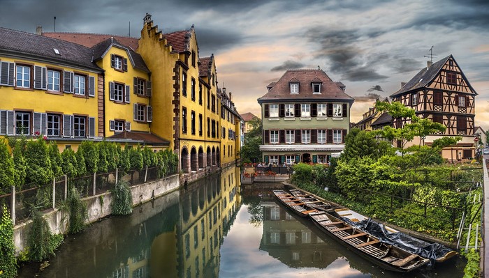 Colmar, France: Canal with historic buildings and boats