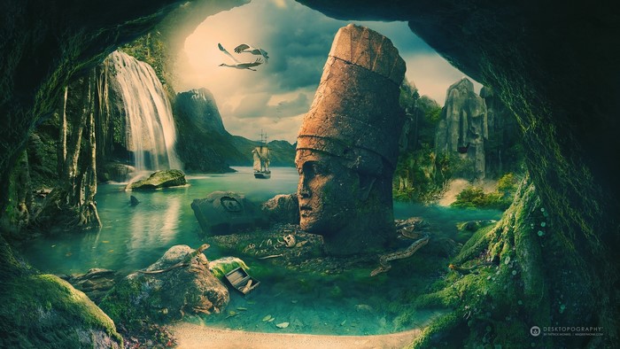 Ancient statue head in a hidden cove with waterfall