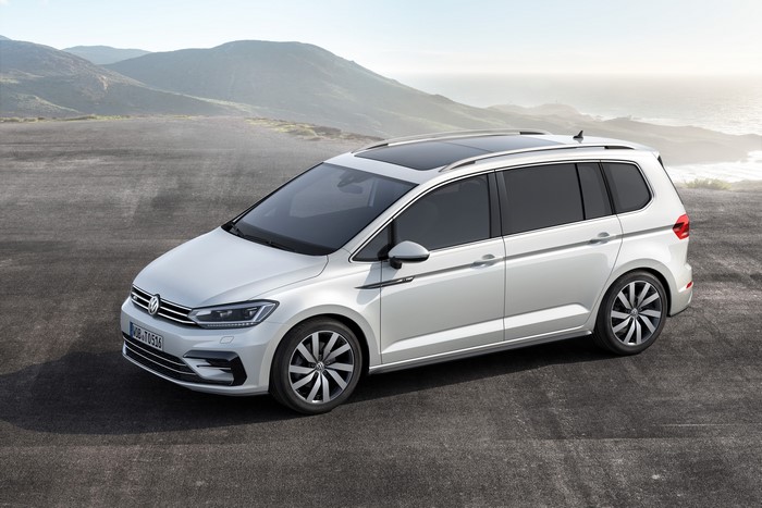 White Volkswagen Touran R-line parked outdoors