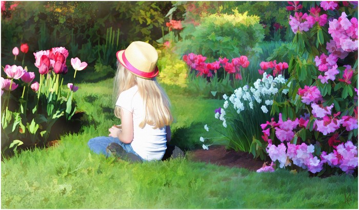 Girl in Hat in Garden with Flowers