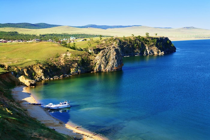 Lake Baikal coast with a boat and village