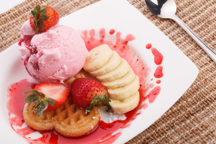 Strawberry ice cream with waffles, strawberries, and bananas