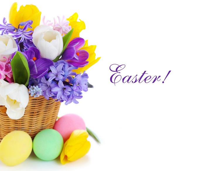 Easter basket with tulips, hyacinths, crocuses, and eggs