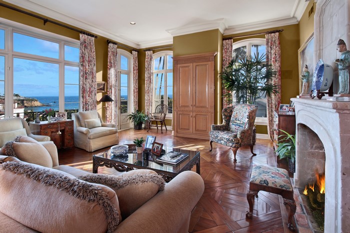 Living room with fireplace and ocean view