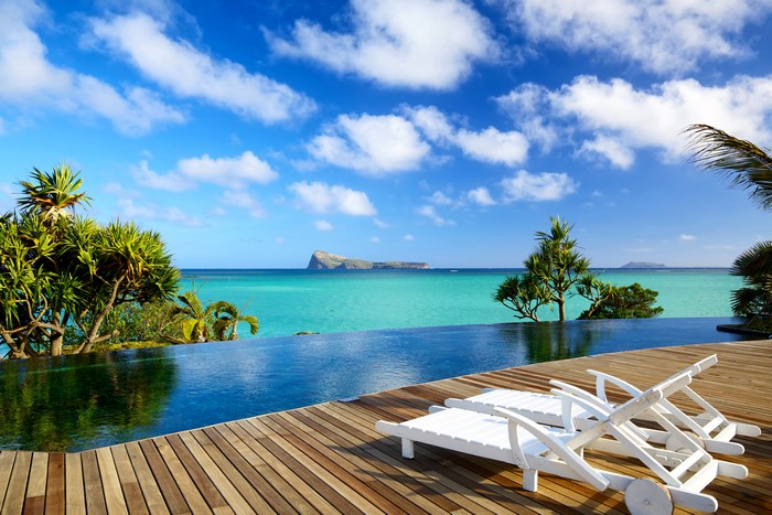 Infinity Pool overlooking turquoise ocean with island