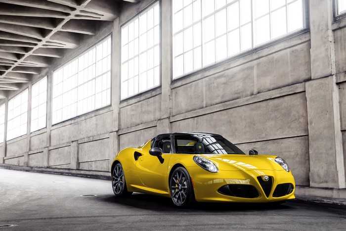 Yellow Alfa Romeo 4C Spider in industrial building