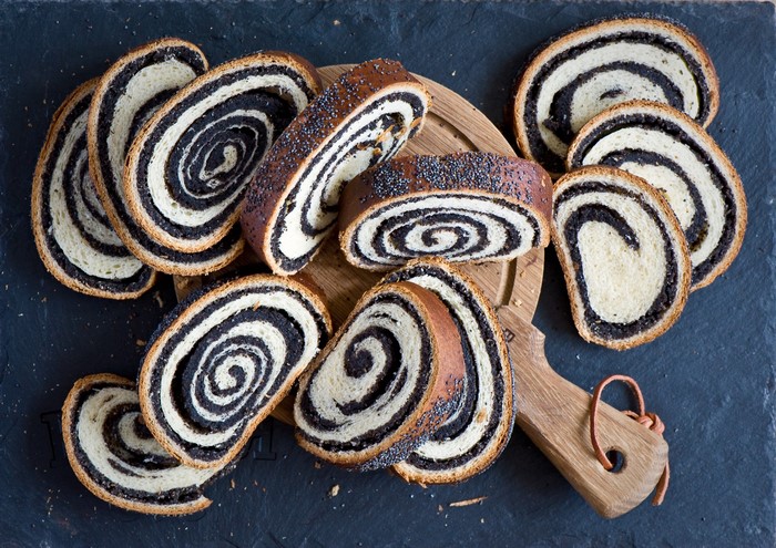 Poppy seed roll slices on a wooden board