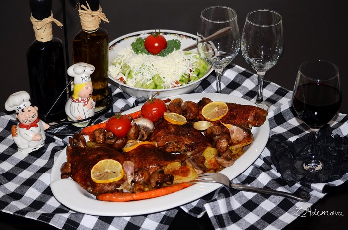 Roasted meat with vegetables and salad