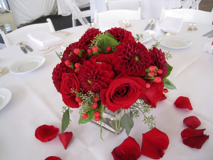Red Dahlias and Roses floral arrangement on a table