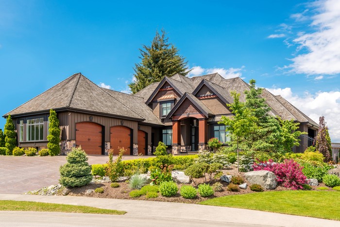Luxury Mansion with Landscaped Gardens and Blue Sky