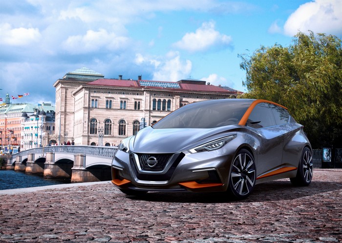 Nissan Sway concept car on cobblestone street with bridge and buildings