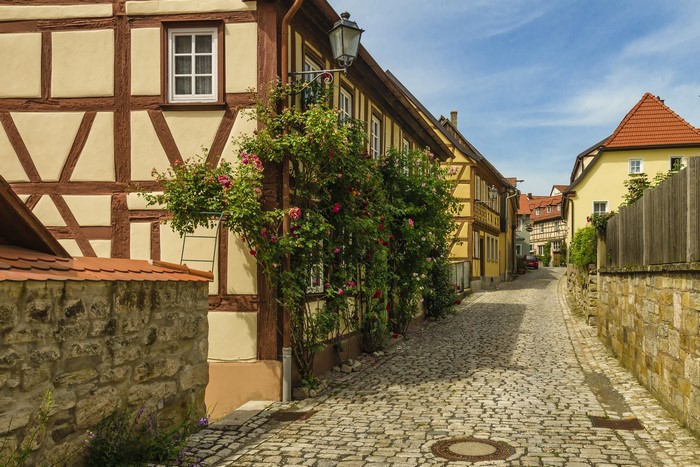 Half-timbered houses on a cobblestone street in Bavaria, Germany